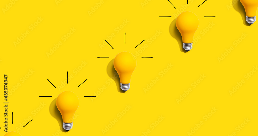 Yellow light bulb pattern with shadow