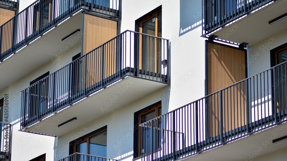 Condominium and apartment building with  symmetrical modern architecture in the city downtown.