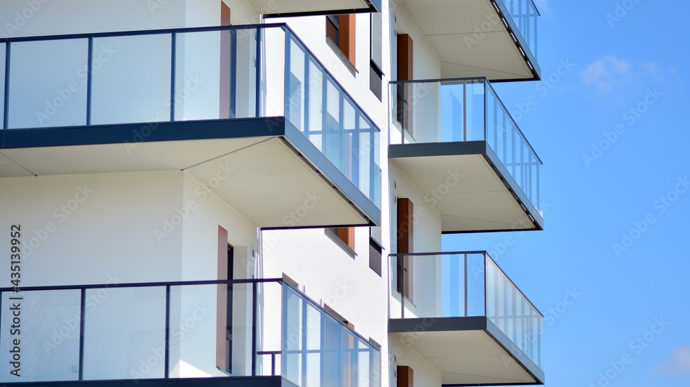 Condominium and apartment building with  symmetrical modern architecture in the city downtown.