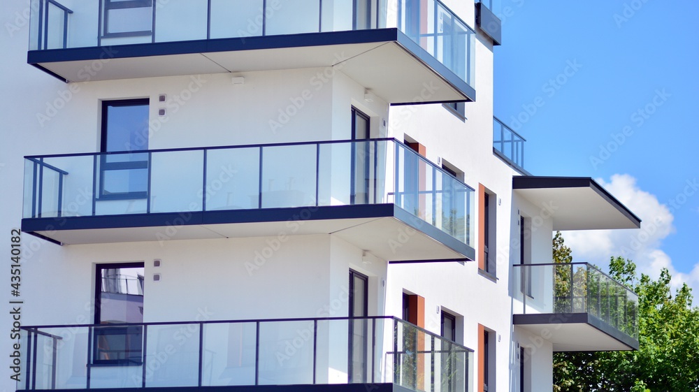 Condominium and apartment building with  symmetrical modern architecture in the city downtown.