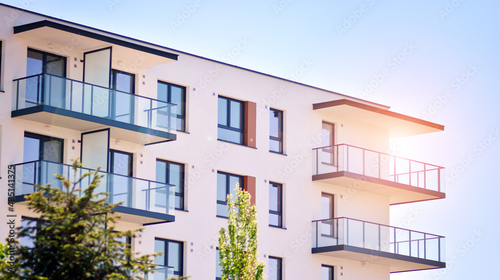 Condominium and apartment building with  symmetrical modern architecture in the city downtown.