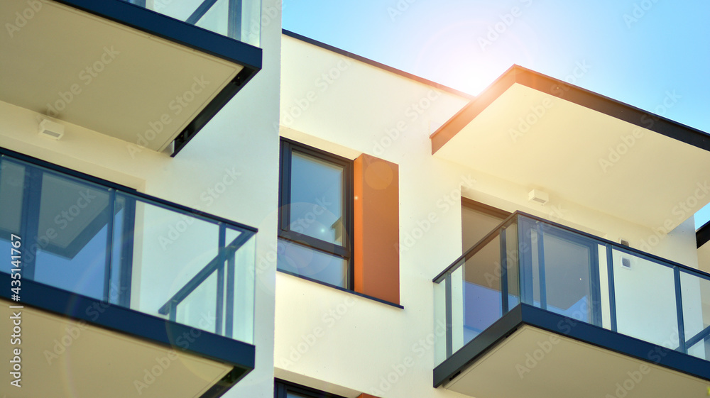 Condominium and apartment building with  symmetrical modern architecture in the city downtown.