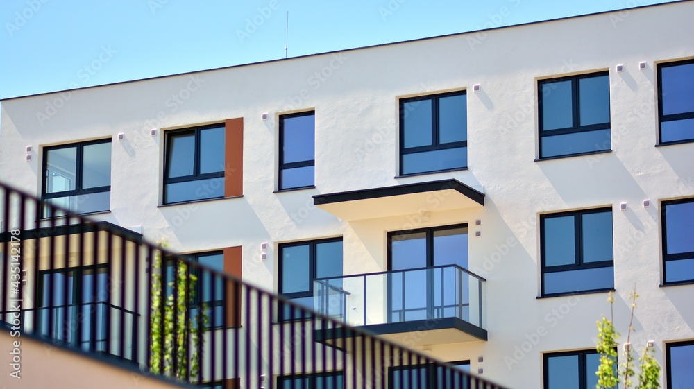 Condominium and apartment building with  symmetrical modern architecture in the city downtown.