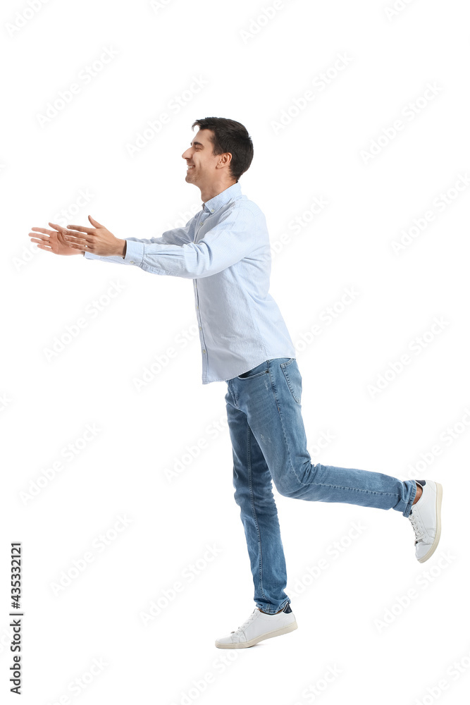 Young man opening arms for hug on white background