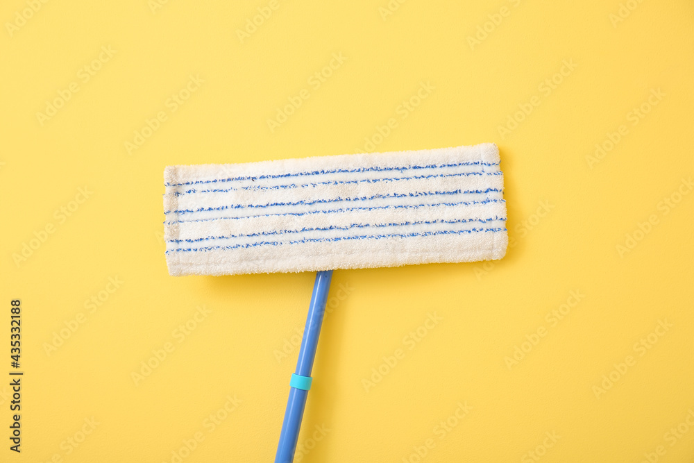 Floor mop on color background, closeup