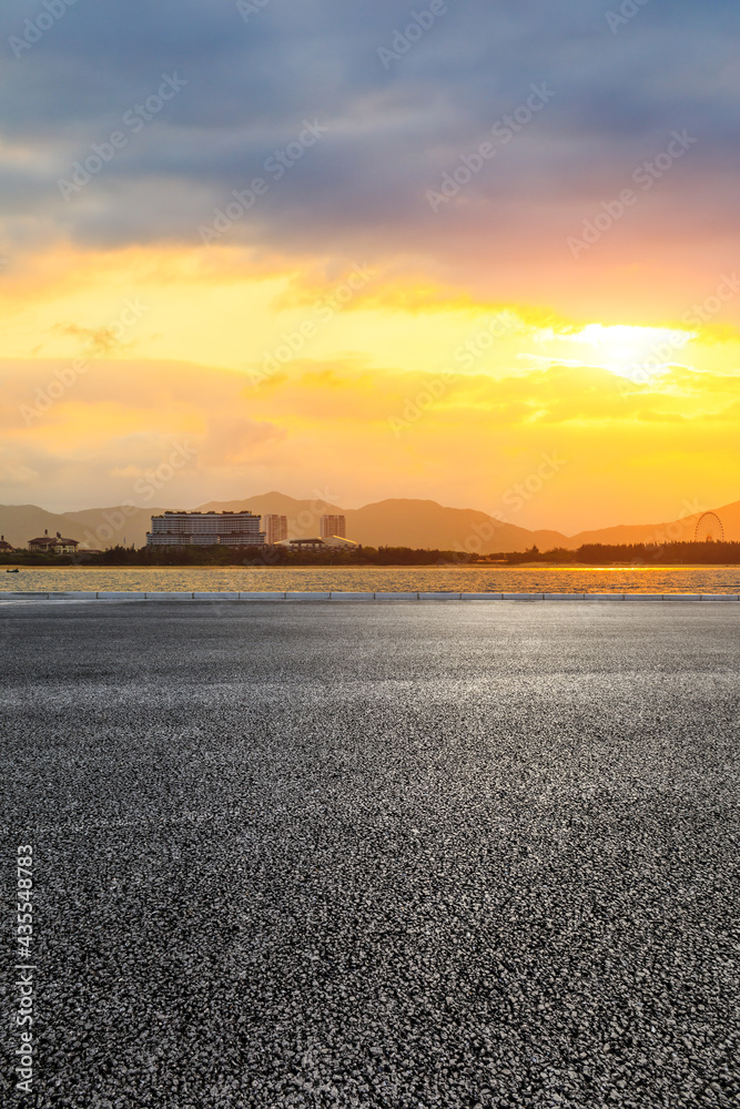 Asphalt road and beautiful seaside scenery at sunset.