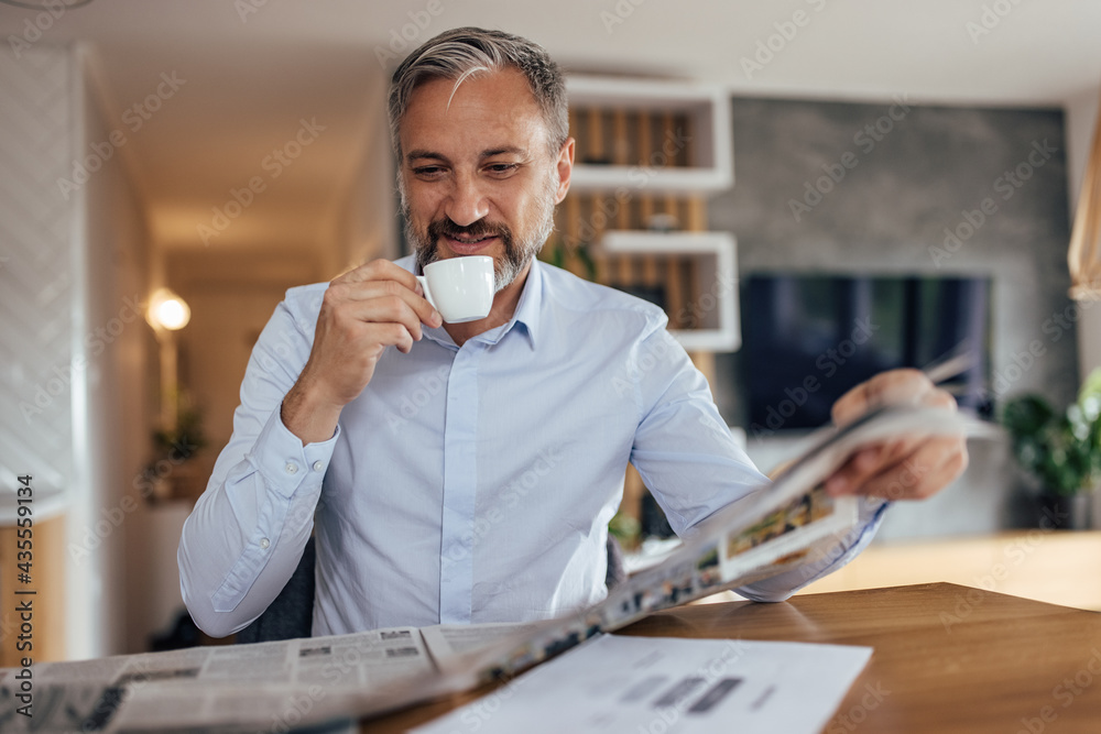 Adult man, getting ready to start his day at home.