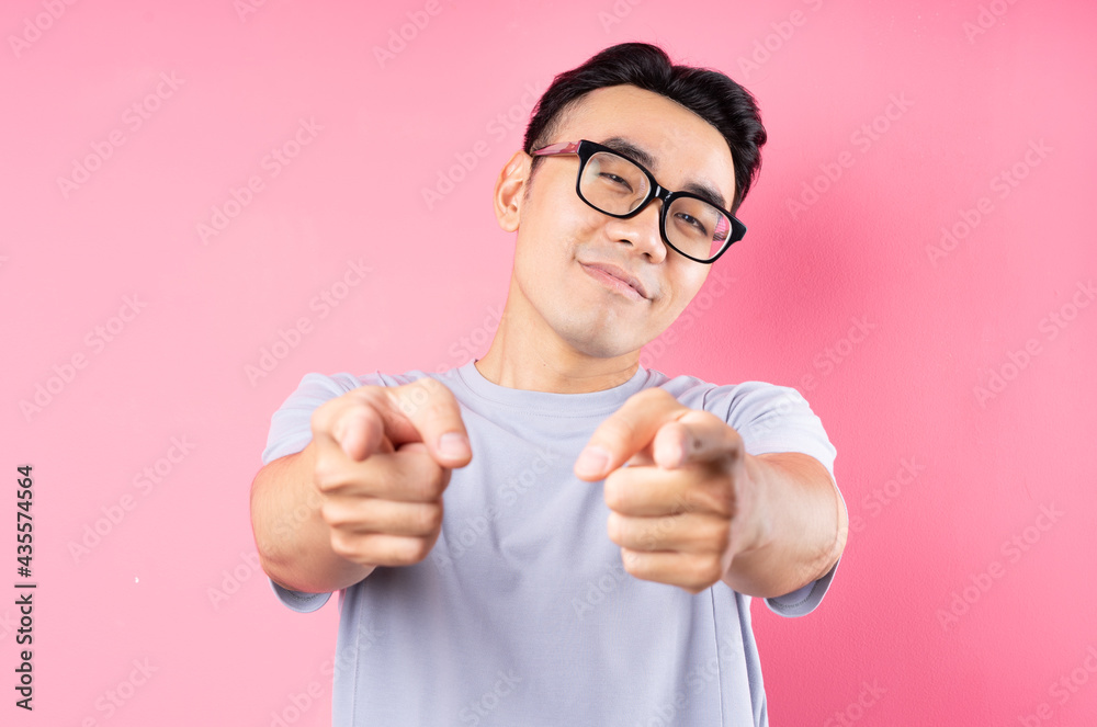 Portrait of Asian man posing on pink background with many expression