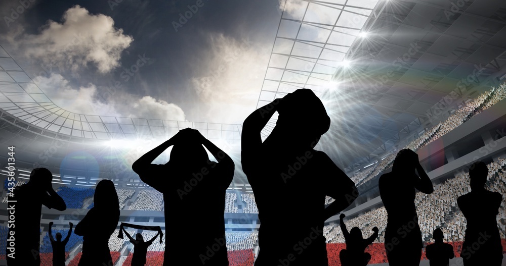 Composition of silhouettes of disappointed sports fans on sports stadium