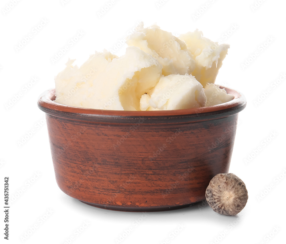 Bowl with shea butter on white background