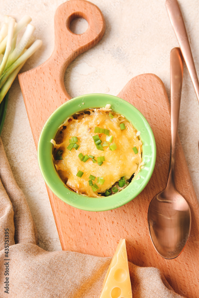 Ramekin with tasty julienne on light background