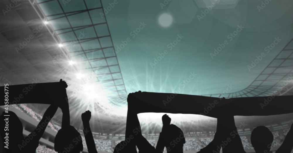 Composition of silhouette of sport fans in sports stadium with glowing spotlights