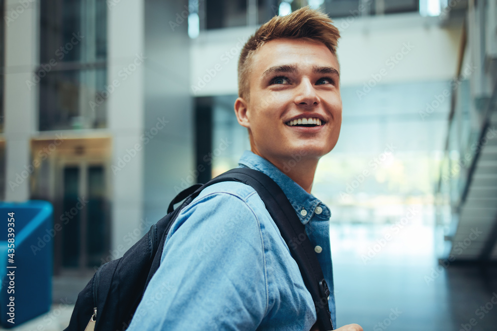 University student looking back and smiling