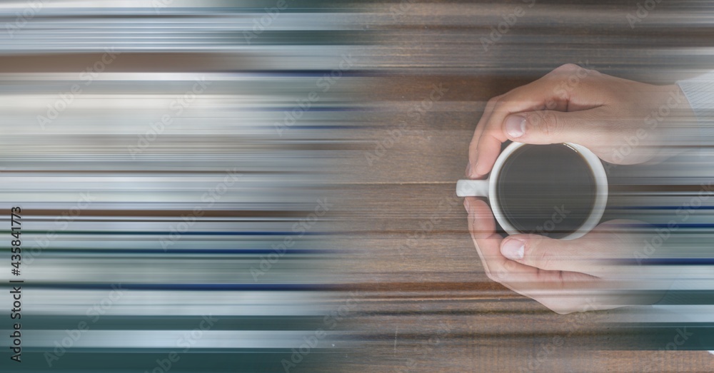 Composition of woman holding cup of coffee over wooden surface with copy space