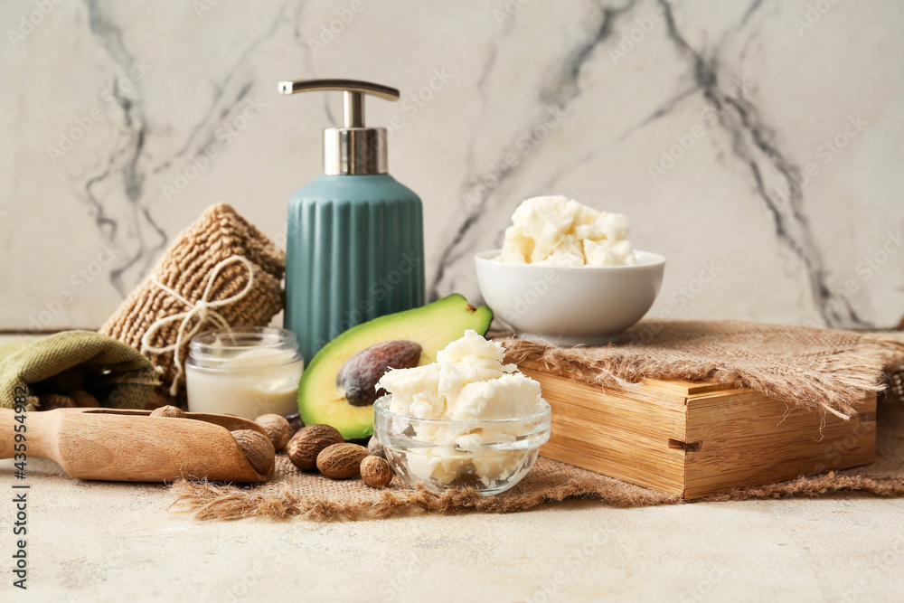 Spa set with shea butter and nuts on light background