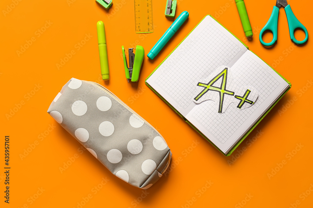 Pencil case and stationery on color background