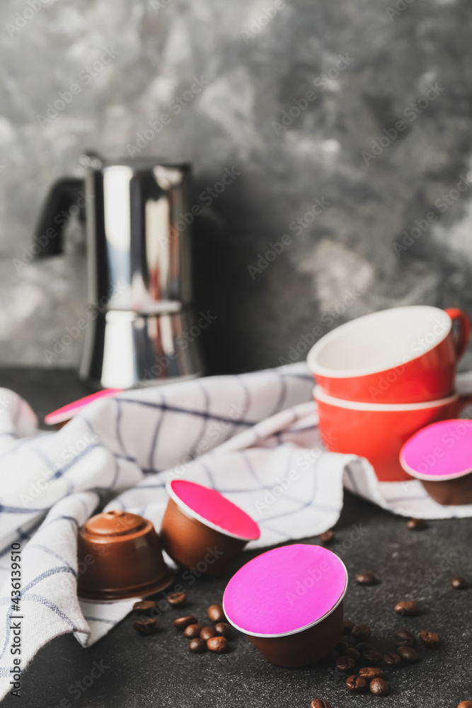 Coffee capsules on dark background