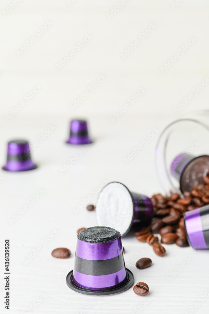 Coffee capsules on white table