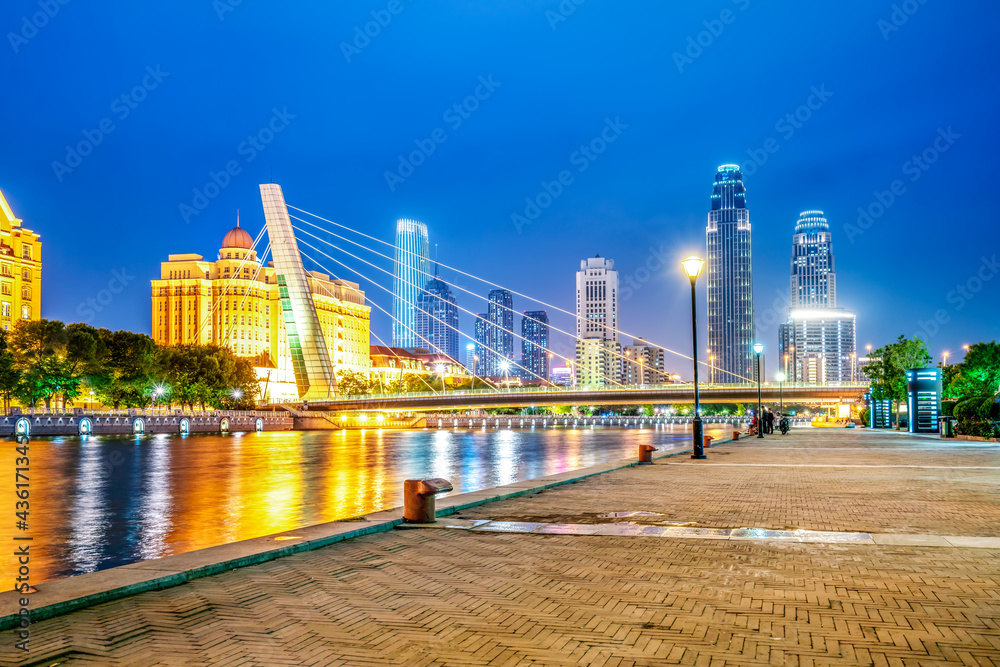 Night view of modern architecture street along Haihe River in Tianjin