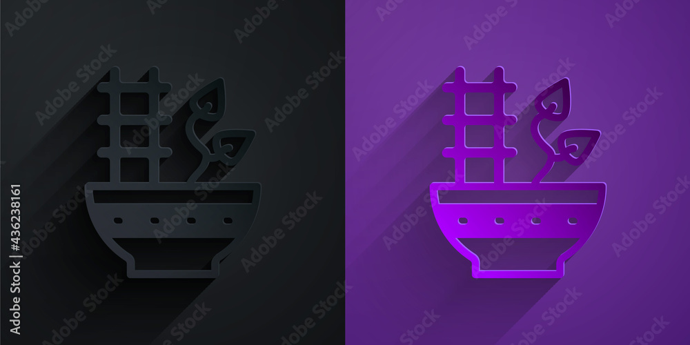 Paper cut Plant in pot icon isolated on black on purple background. Plant growing in a pot. Potted p