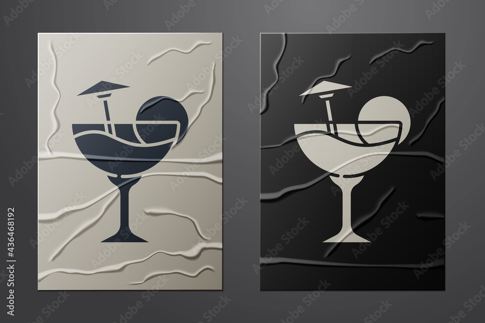 White Cocktail and alcohol drink with umbrella icon isolated on crumpled paper background. Paper art