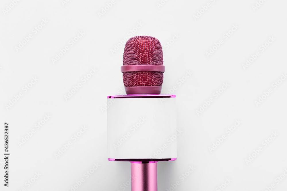 Modern microphone on white background