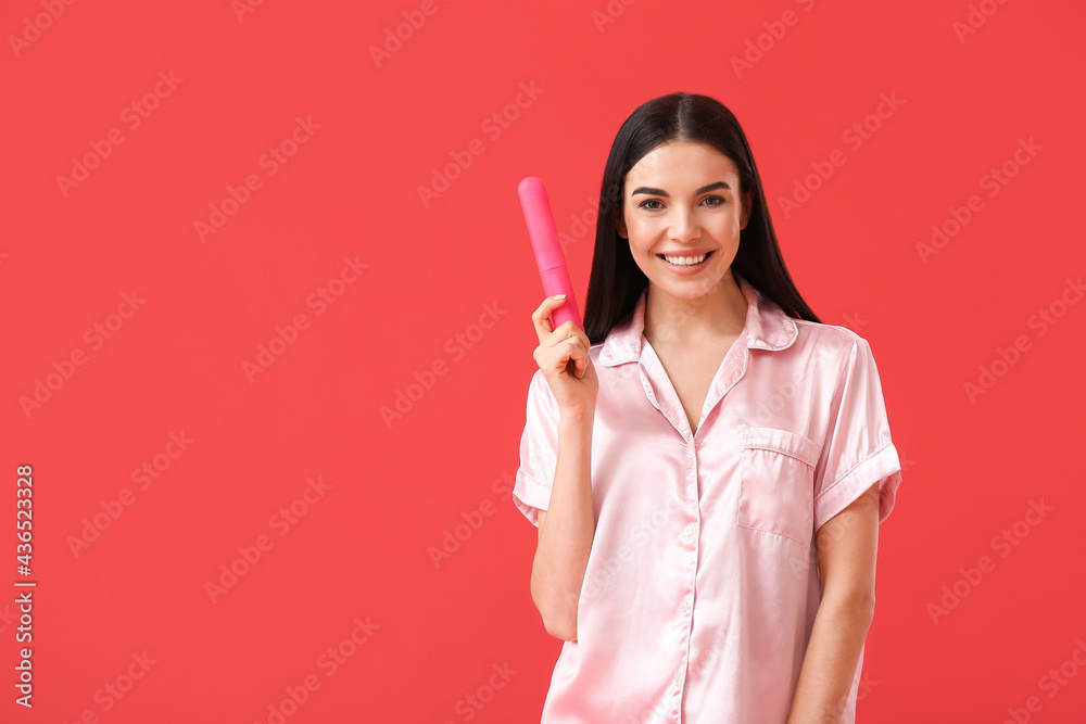 Beautiful woman and case with tooth brush on color background