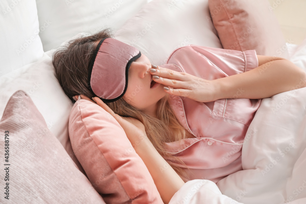 Morning of young woman in bedroom