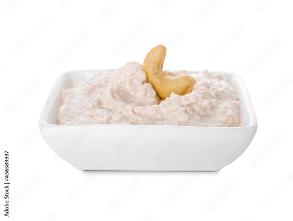 Bowl with cashew sour cream on white background