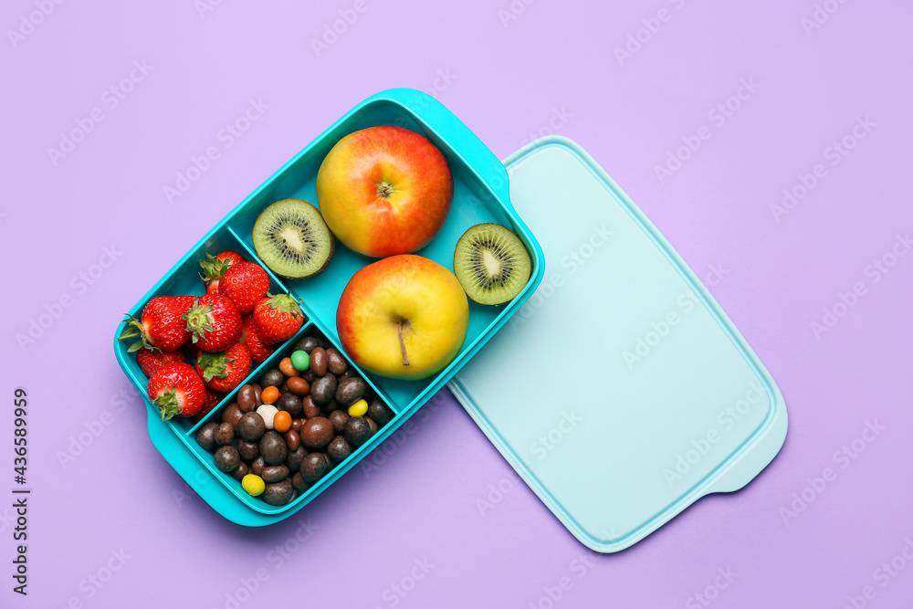 Lunchbox with tasty food on color background