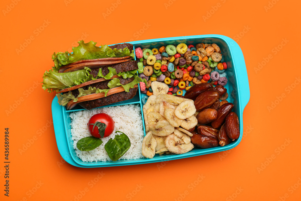 Lunchbox with tasty food on color background