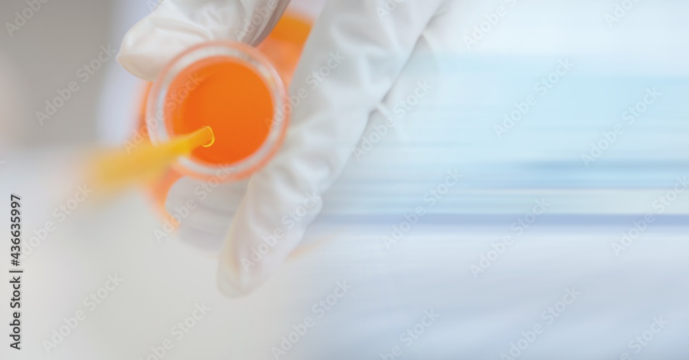 Composition of scientist holding dish with orange liquid with copy space