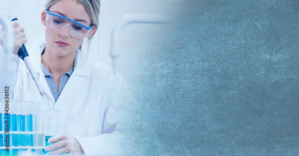 Composition of female lab technician using pipette, with blue blurred copy space to right