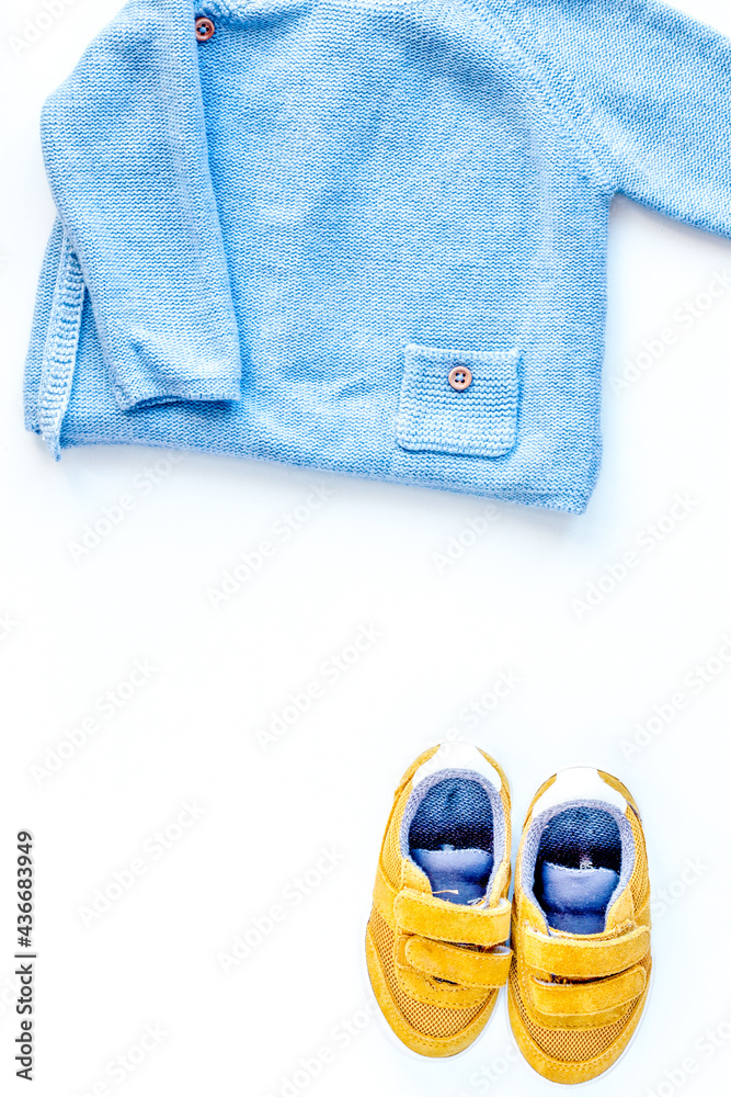 Baby clothes and toys on white background top view mock up