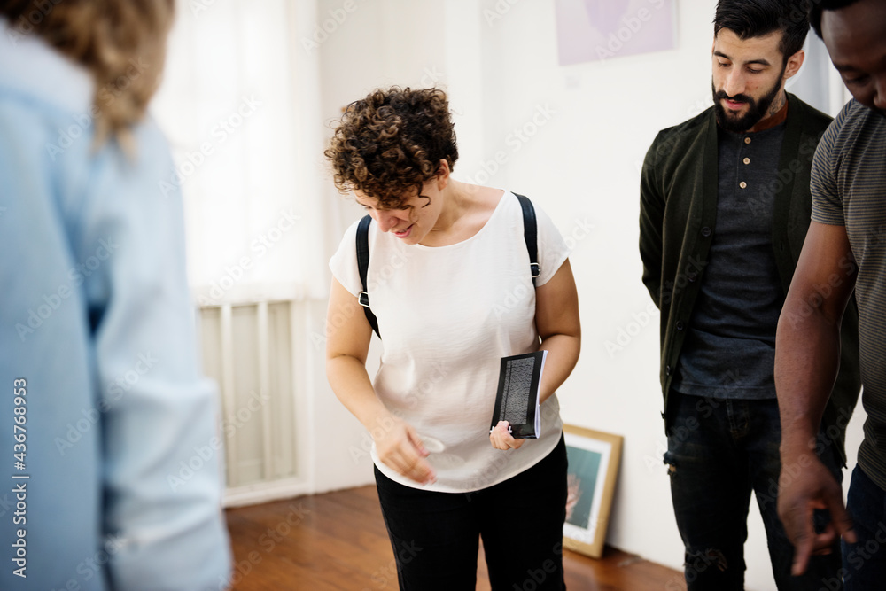 People attending an art exhibition