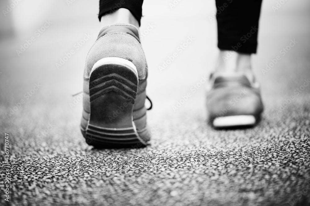 Woman walking on a road