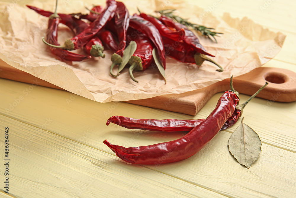 Hot chili peppers on wooden background