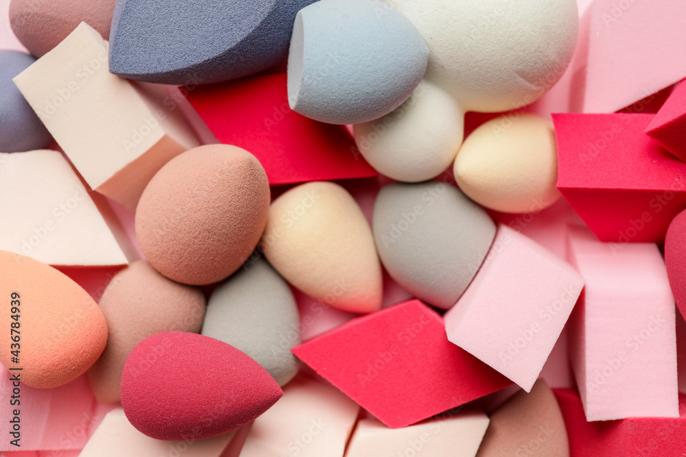 Heap of makeup sponges as background