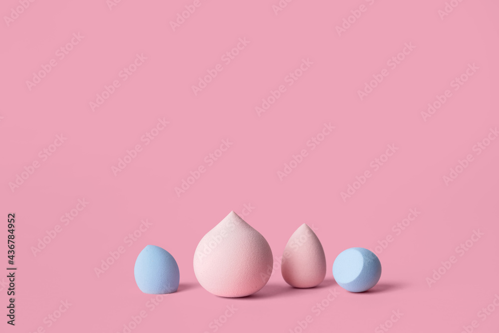 Makeup sponges on color background