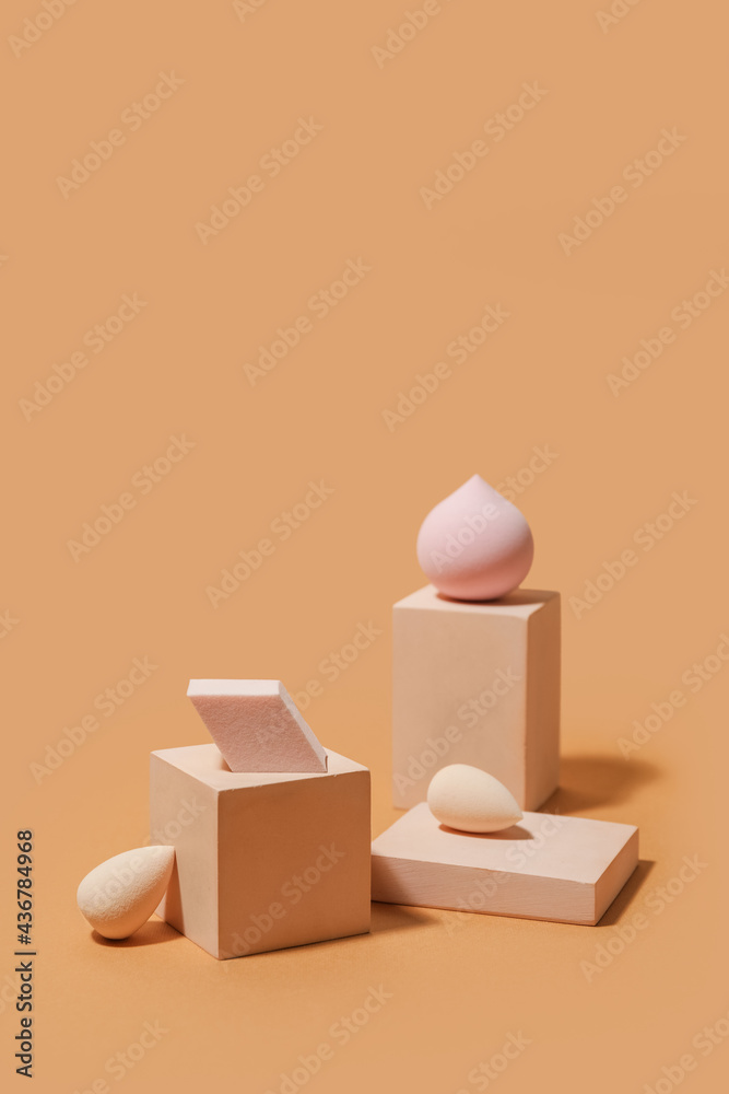 Makeup sponges on color background