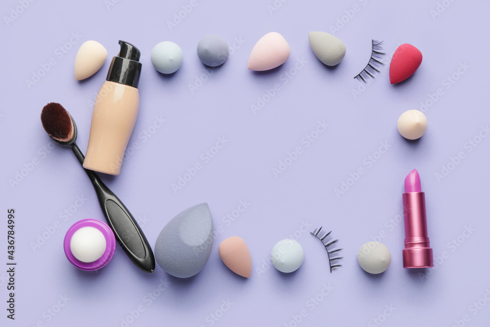 Frame made of makeup items on color background