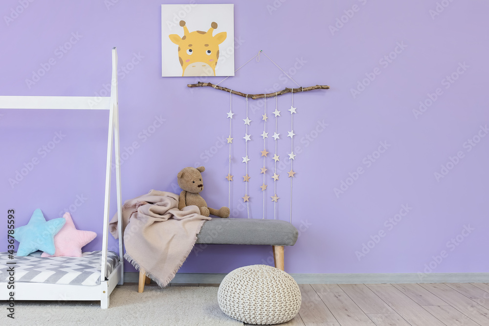 Interior of stylish childrens room with comfortable bed