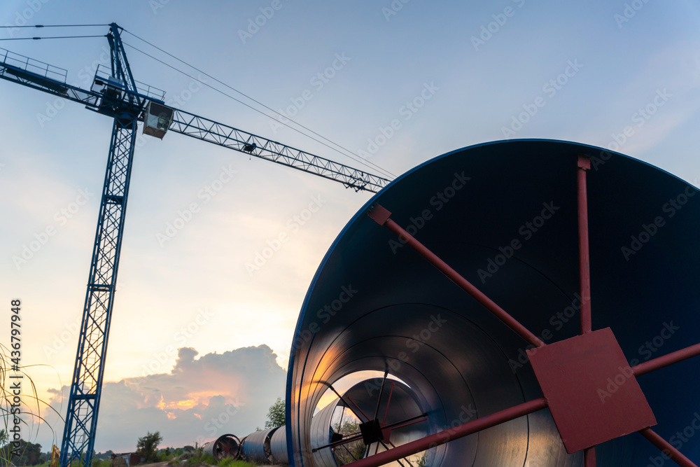 Construction crane for laying large steel pipes for drinking water project under town planning, Larg