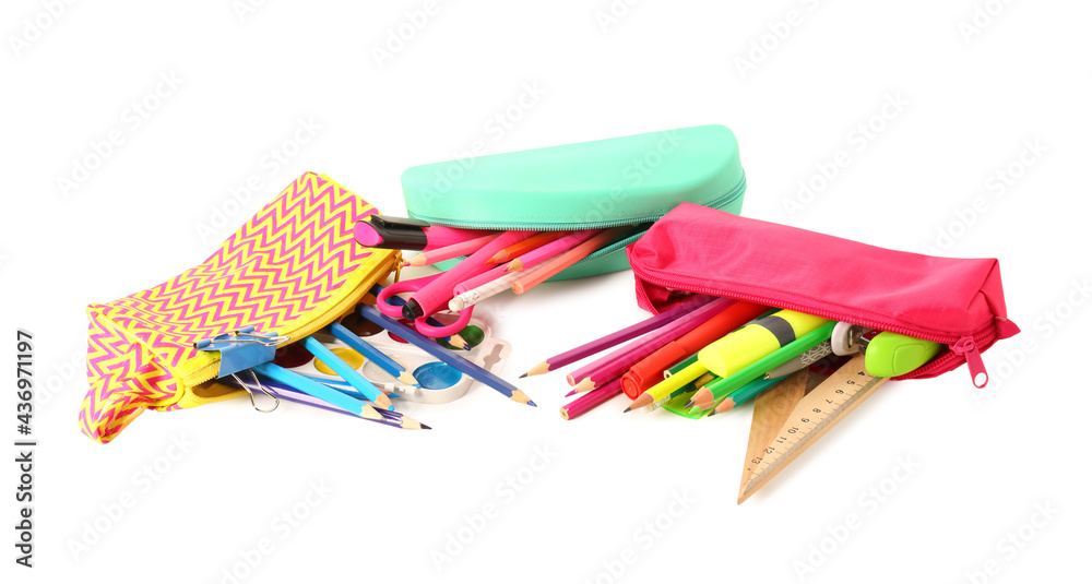 Pencil cases with stationery on white background