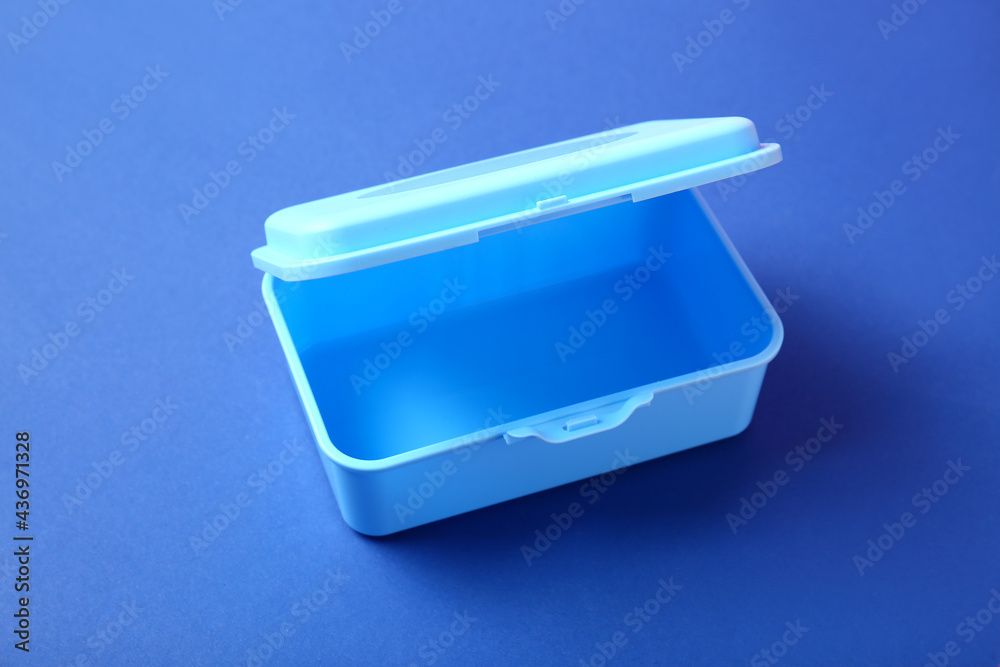 Plastic lunch box on color background