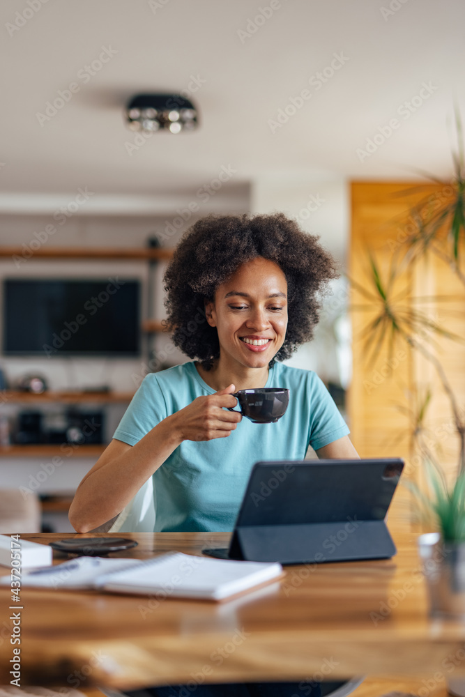 Relaxed black woman, taking a breather, during work.