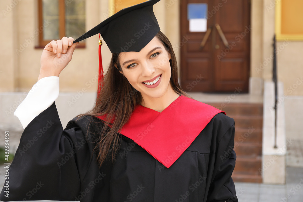 Female student in bachelor robe on her graduation day