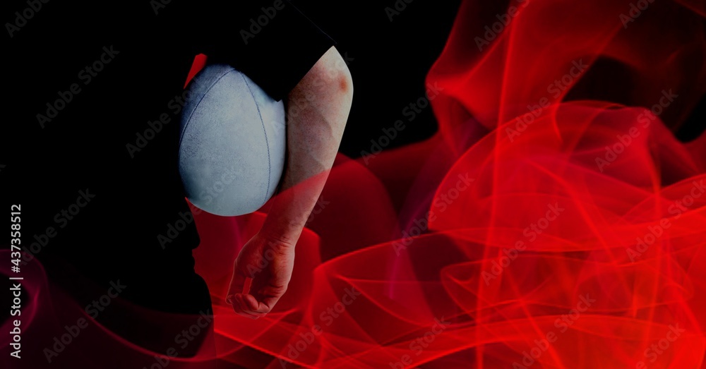 Compostion of caucasian rugby player holding ball on black background with red blur