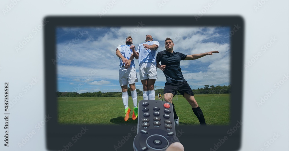 Compostion of caucasian man watching football match on tv on white background