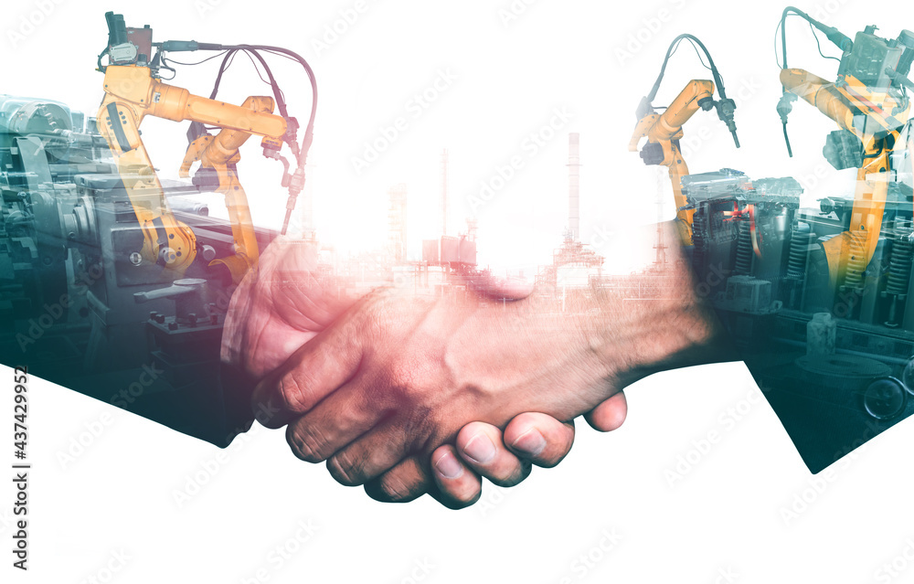 Mechanized industry robot arm and business handshake double exposure . Concept of successful agreeme